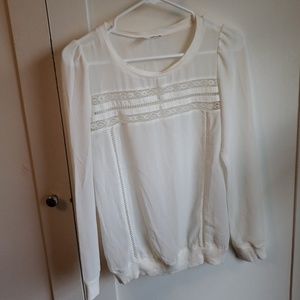 Sheer blouse with lace detail across chest